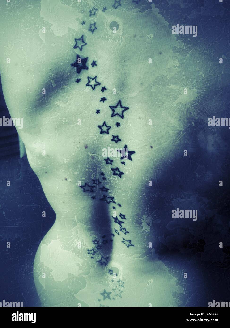 Stars tattoos on female back Stock Photo