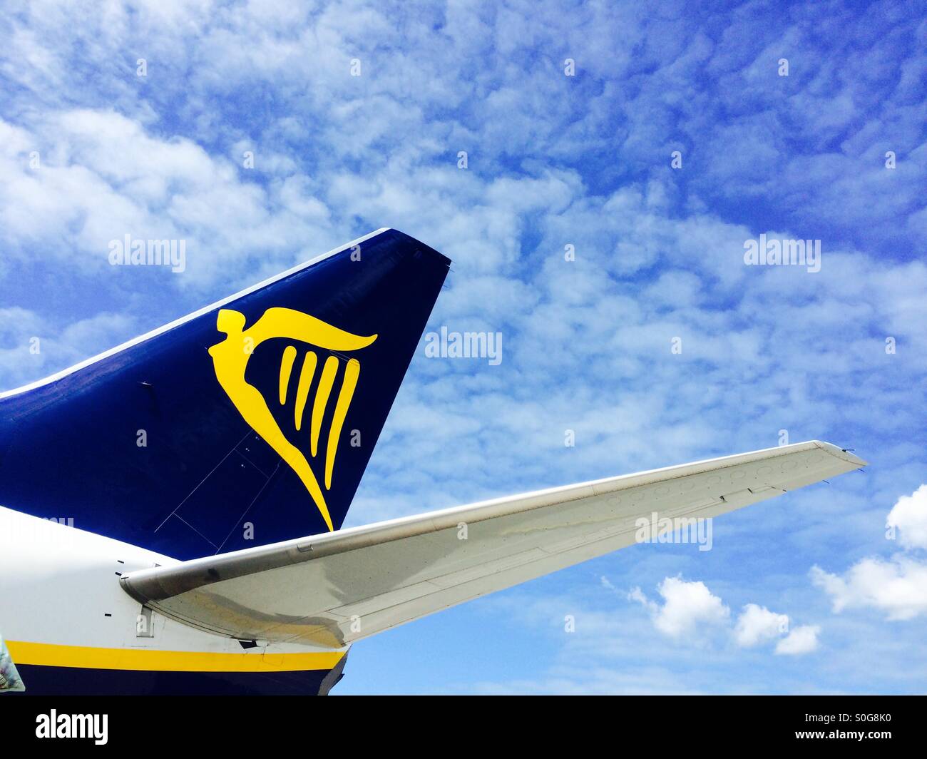 Tail of a RyanAir plane against blue sky. Stock Photo