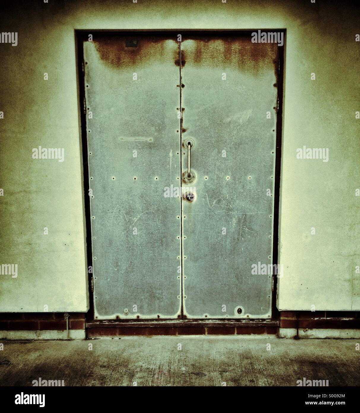 Grungy metal door tightly shut - Smartphone Captured Stock Image