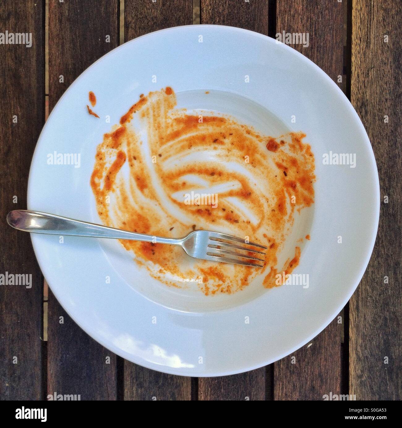 Empty plate with pasta sauce Stock Photo Alamy