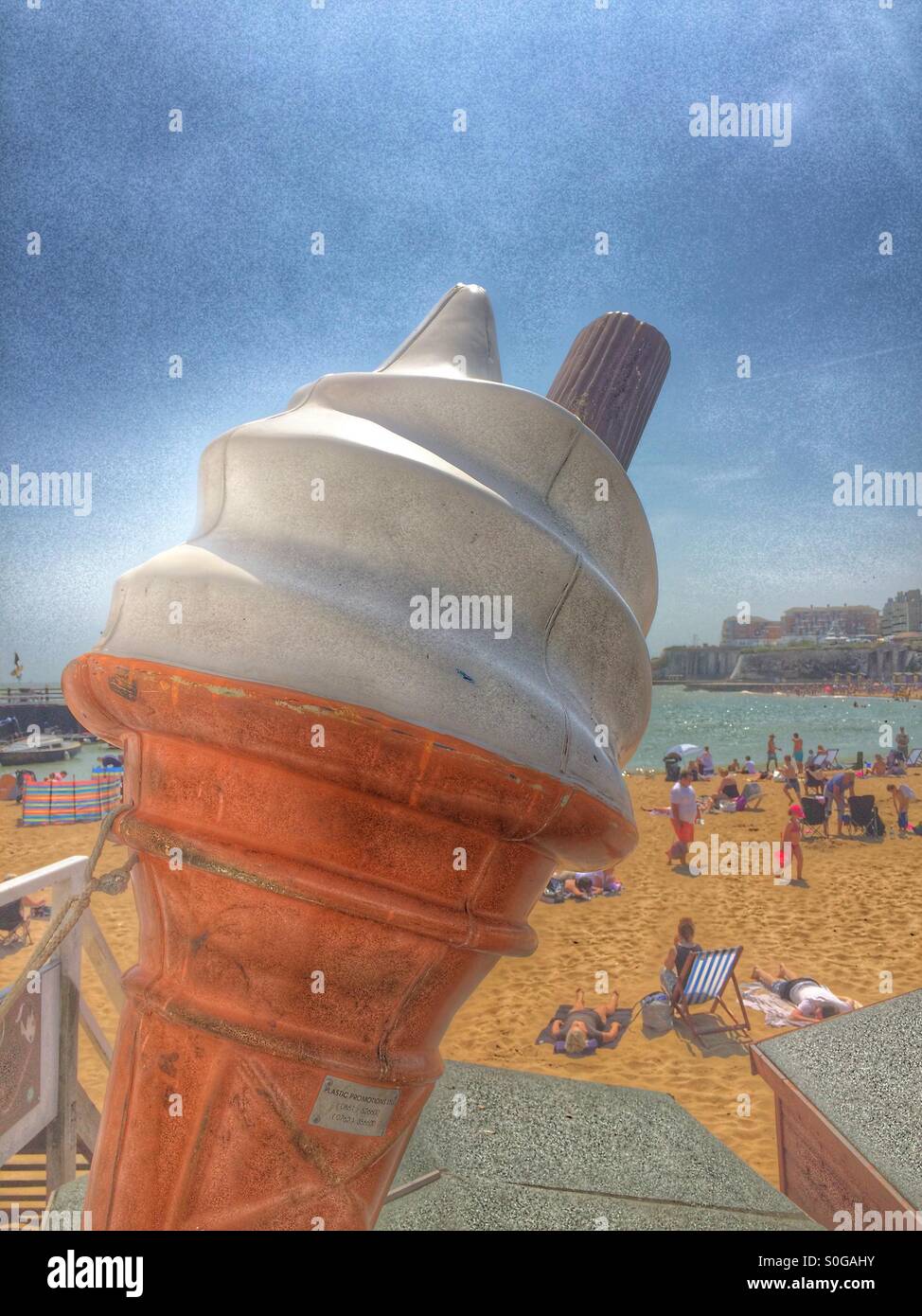 Large ice cream on a shop with beach scene behind - Smartphone Captured Stock Image Large ice cream on a shop with beach scene behind - Smartphone Captured Stock Image