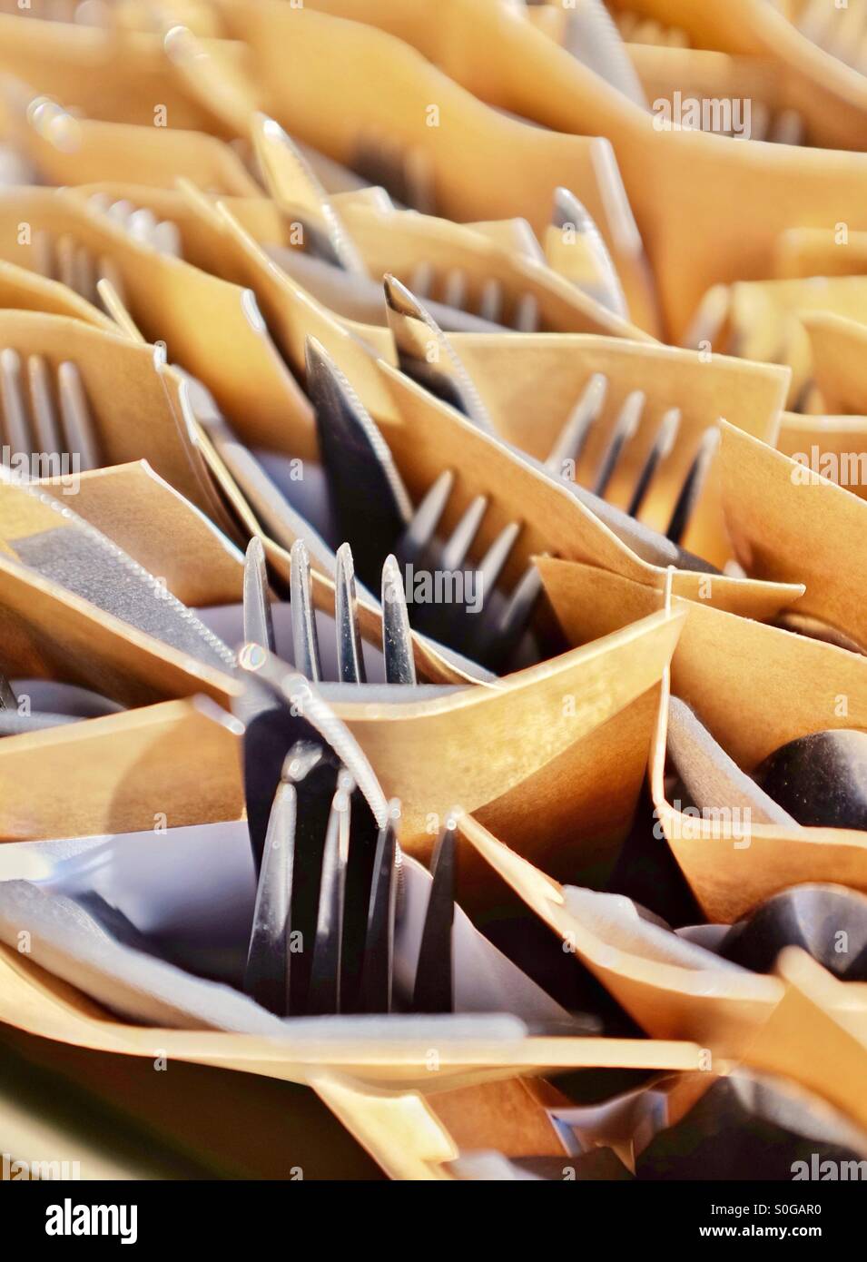 Knives and forks prepared as sets Stock Photo