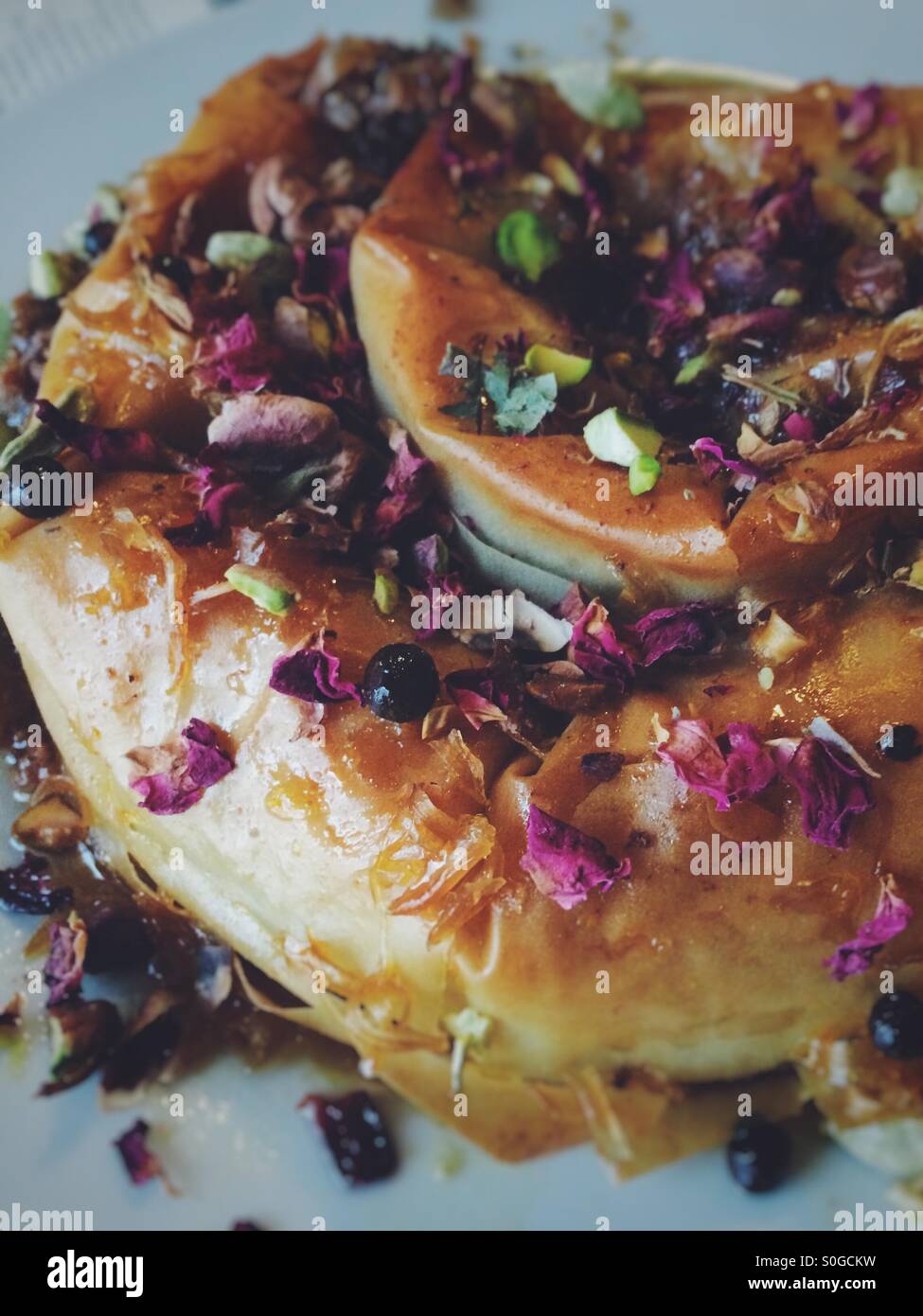 M'Hencha, a typical Moroccan pastry with pistachios, almonds and honey - Smartphone Captured Stock Image