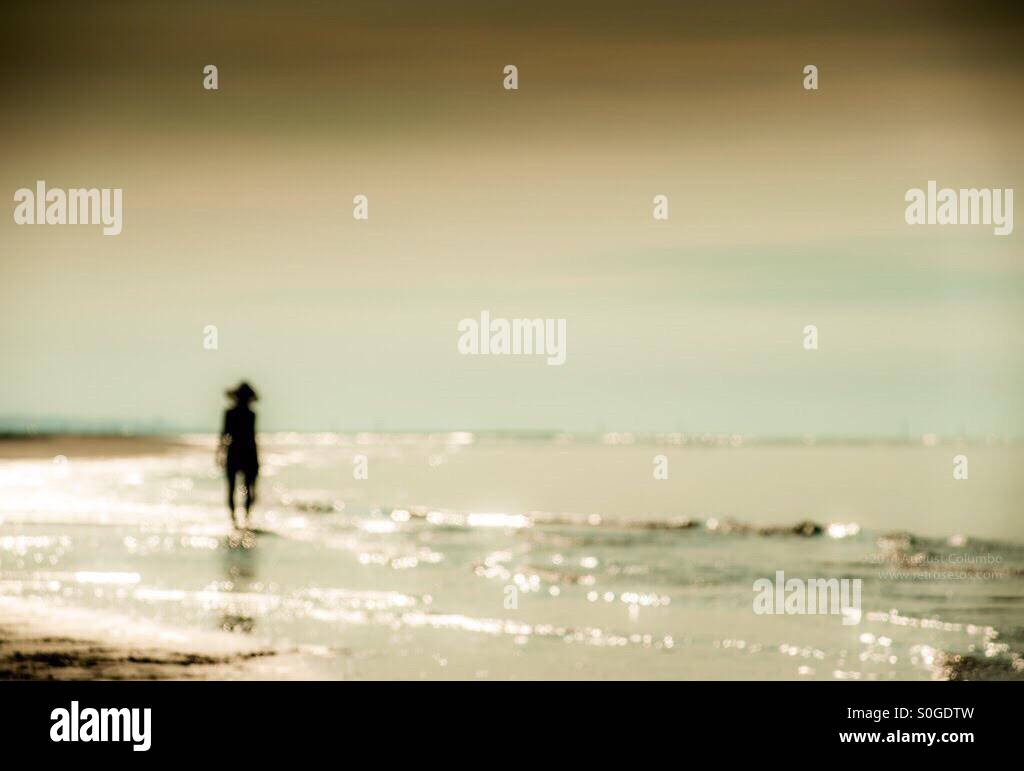 Woman alone walk beach hi-res stock photography and images - Alamy