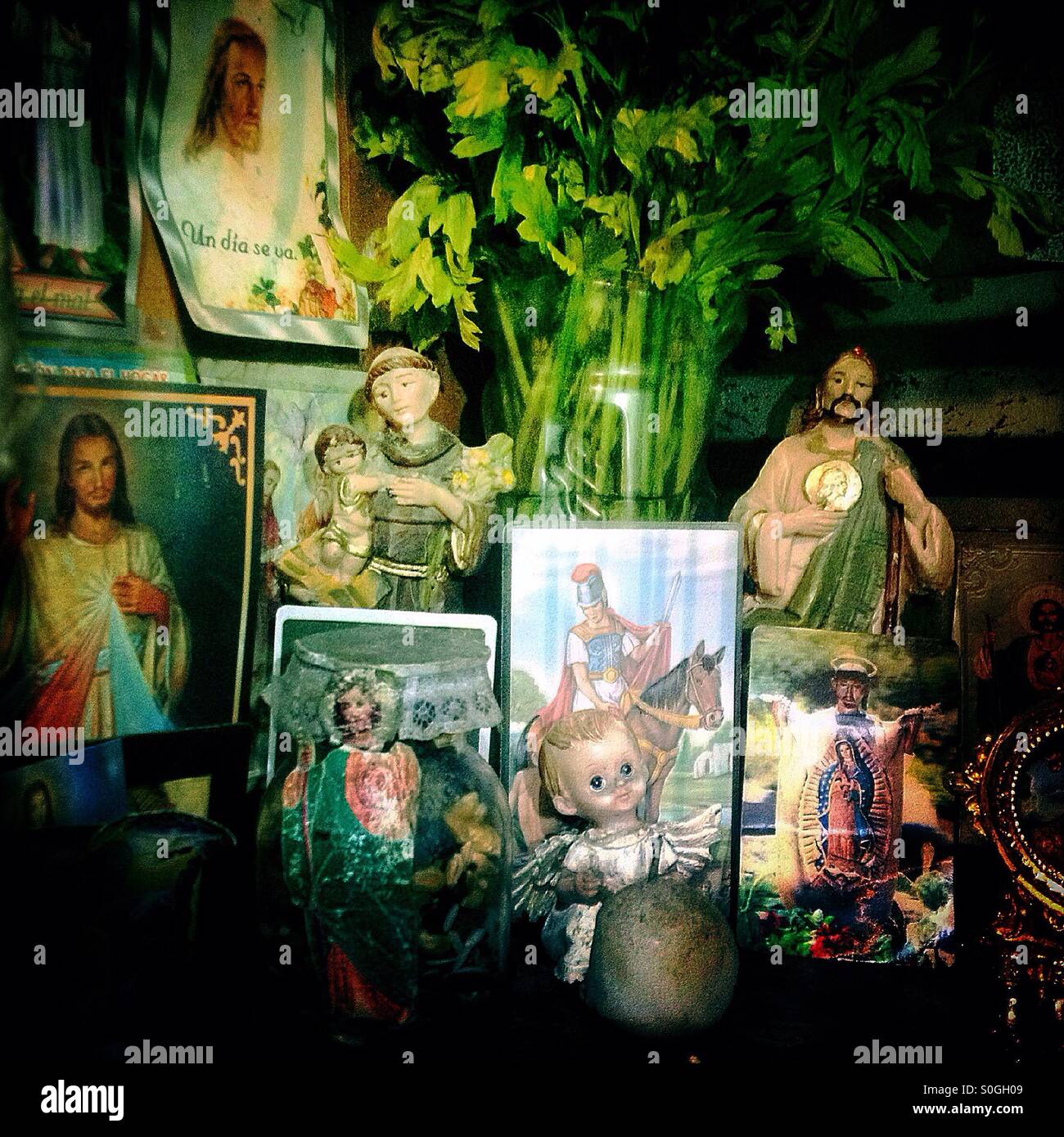 An altar decorated with saints in Mercado de Medellin market, Colonia Roma, Mexico City, Mexico Stock Photo