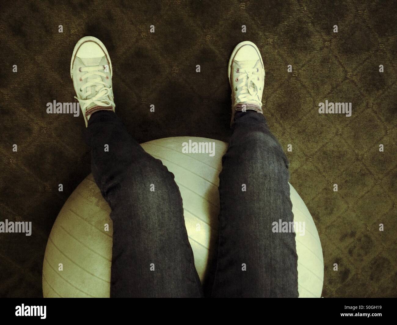 Sitting on a fitness ball - Smartphone Captured Stock Image