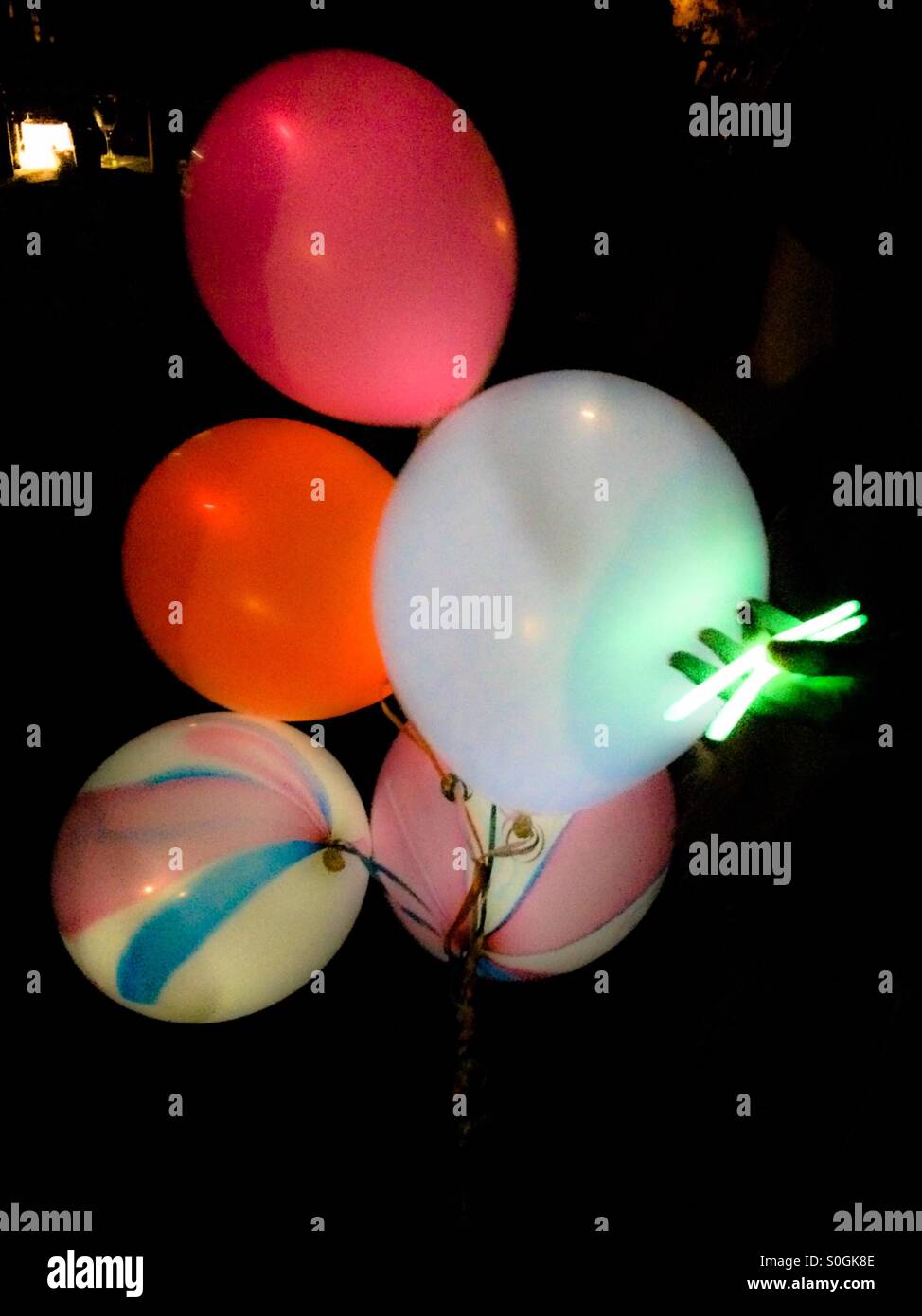 Glow in the dark balloons at a nighttime dance concert Stock Photo Alamy