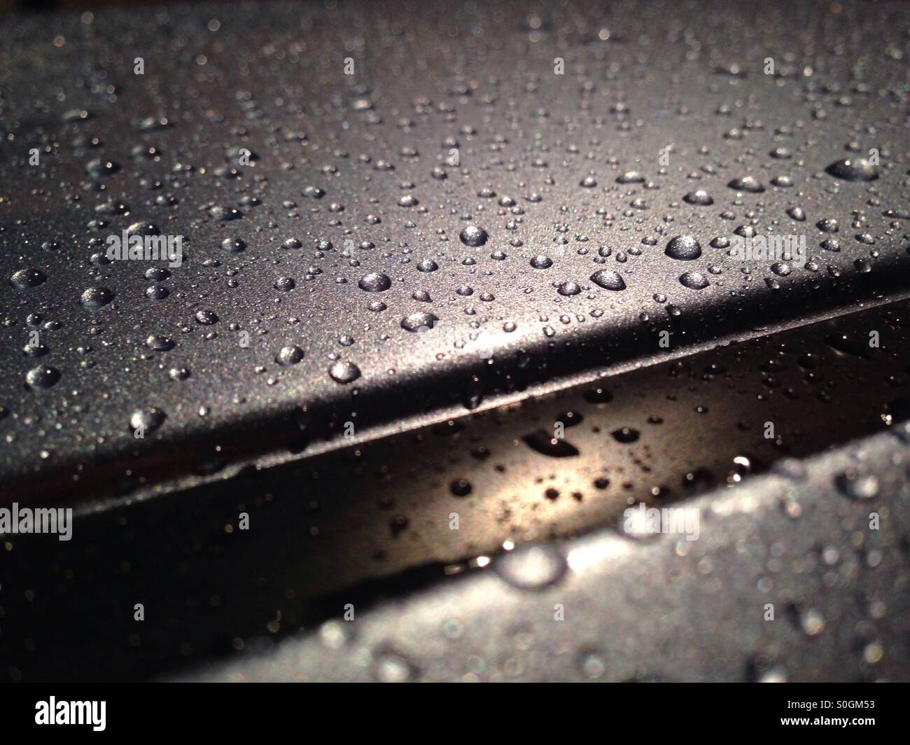 Water beading on car paint Stock Photo