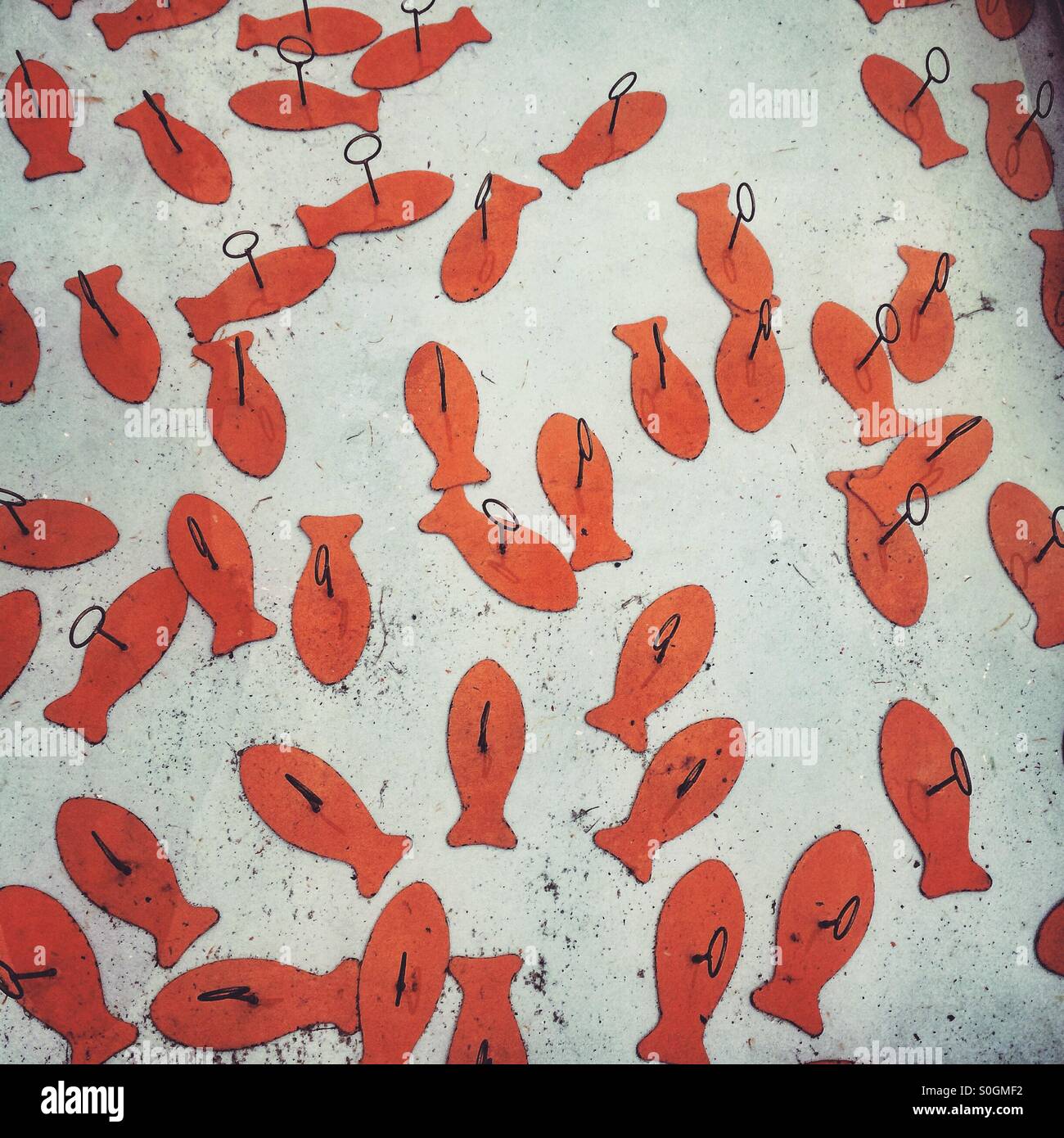 Hook a fish game at a fairground Stock Photo Alamy