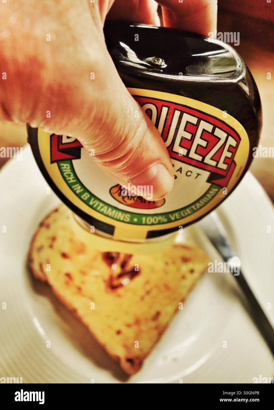 Morning squeeze - love it or hate it Marmite toast - Smartphone Captured Stock Image