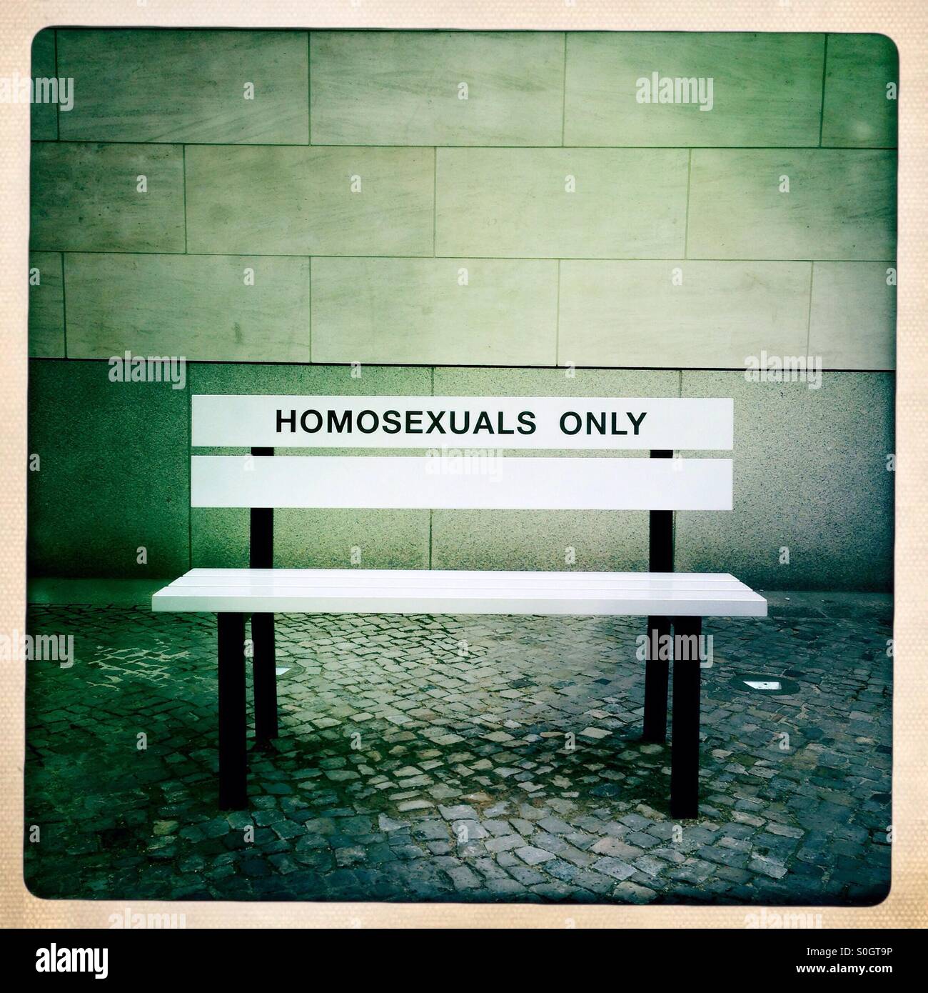 A Bench in front of the German historical Museum in Berlin Mitte Germany Claims Homosexuals only. It is Part of an exhibition about the history of homosexualities in the Second half of the year 2015 Stock Photo