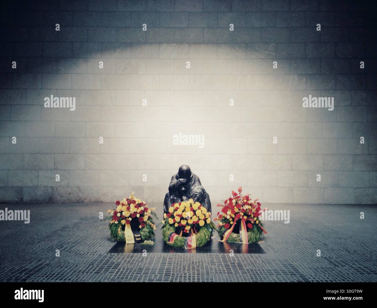 Pieta Sculpture of a mother and her Dead son in the Memorial for the suffering during war and dictatorship in the Former Royal guardhouse neue Wache in Berlin Germany at unter den Linden - Smartphone Captured Stock Image