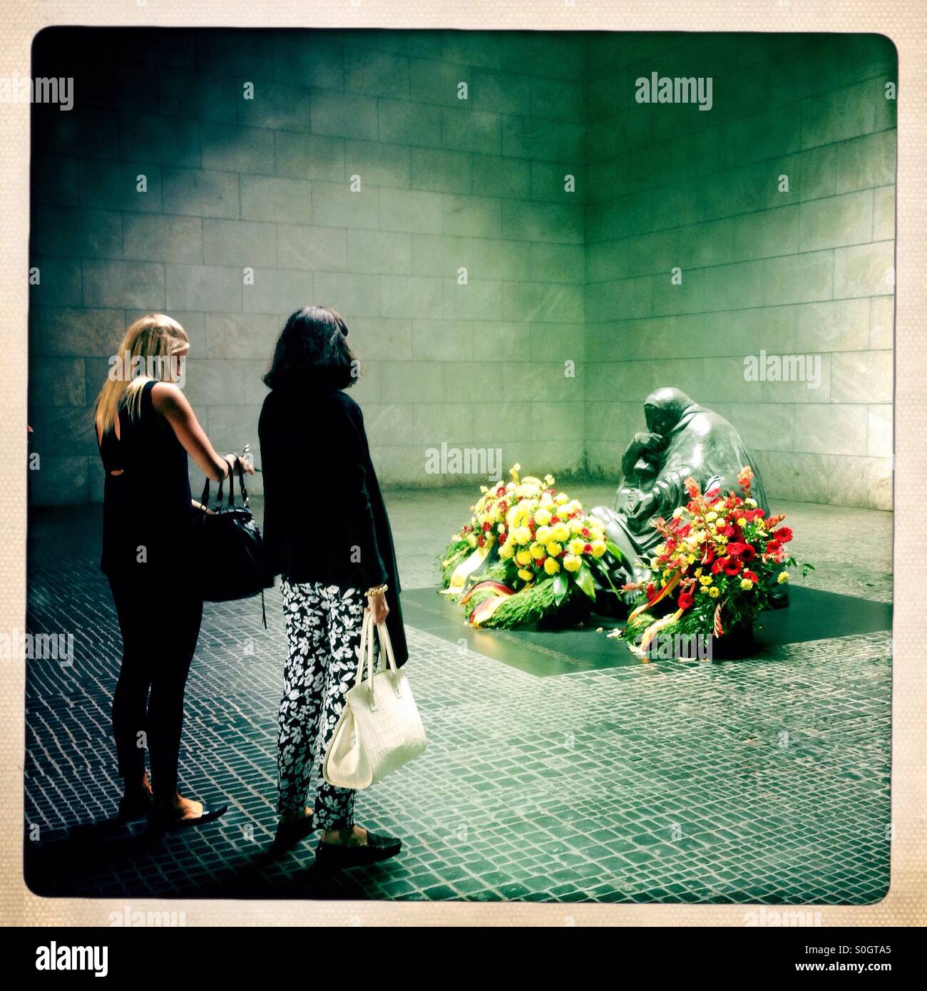 Pieta Sculpture of a mother and her Dead son in the Memorial for the suffering during war and dictatorship in the Former Royal guardhouse neue Wache in Berlin Germany at unter den Linden - Smartphone Captured Stock Image