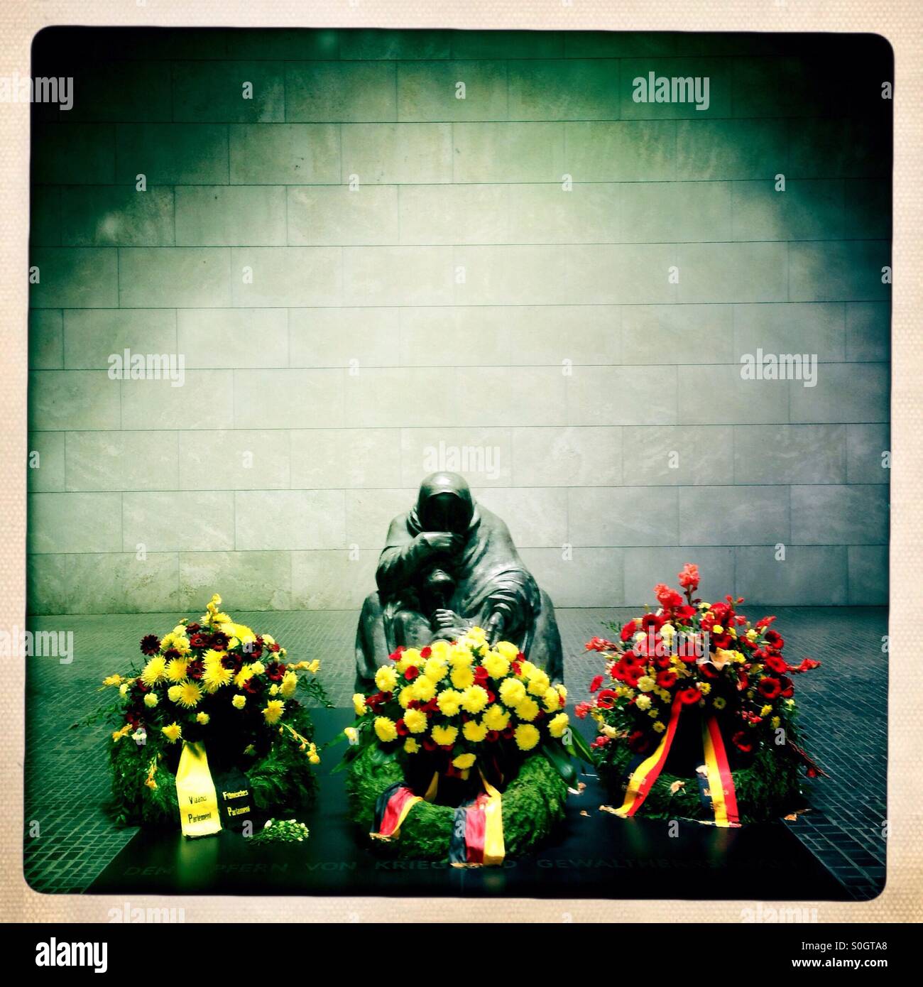 Pieta Sculpture of a mother and her Dead son in the Memorial for the suffering during war and dictatorship in the Former Royal guardhouse neue Wache in Berlin Germany at unter den Linden - Smartphone Captured Stock Image