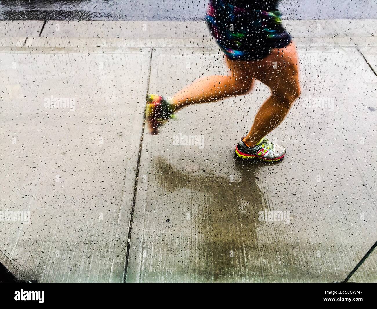 Jogger in the rain Stock Photo