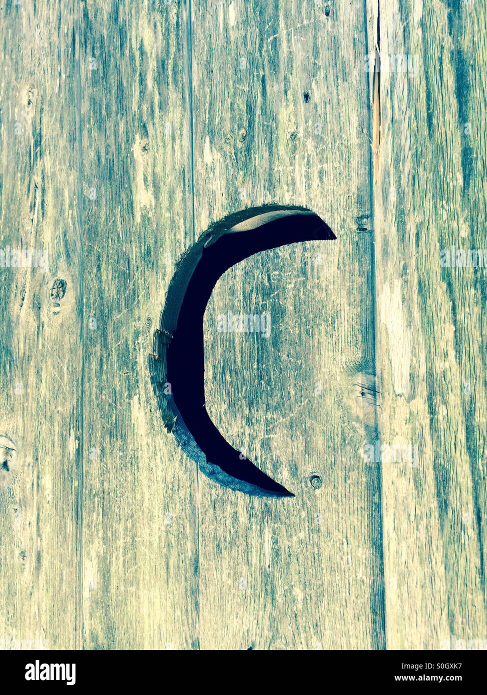 Moon cut into an outhouse door Stock Photo - Alamy