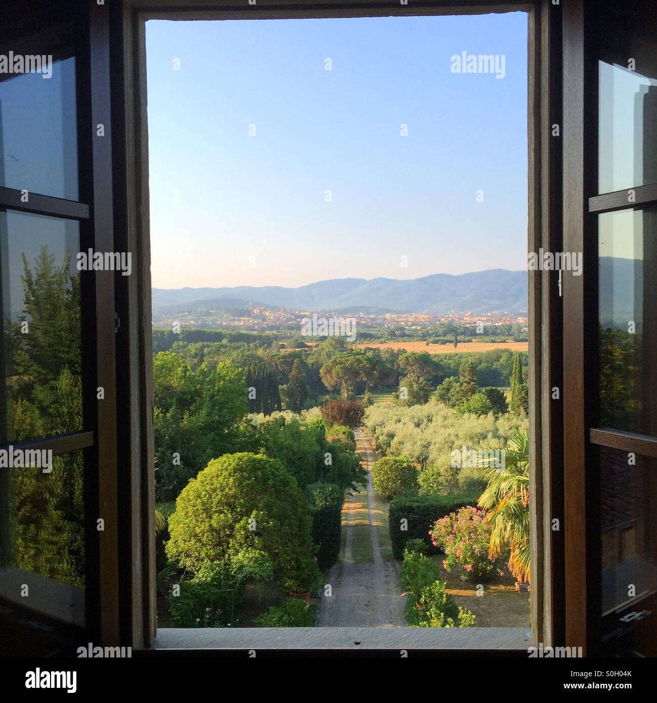 An open window with a view of Tuscany and Arezzo from Ceciliano, Italy. - Smartphone Captured Stock Image