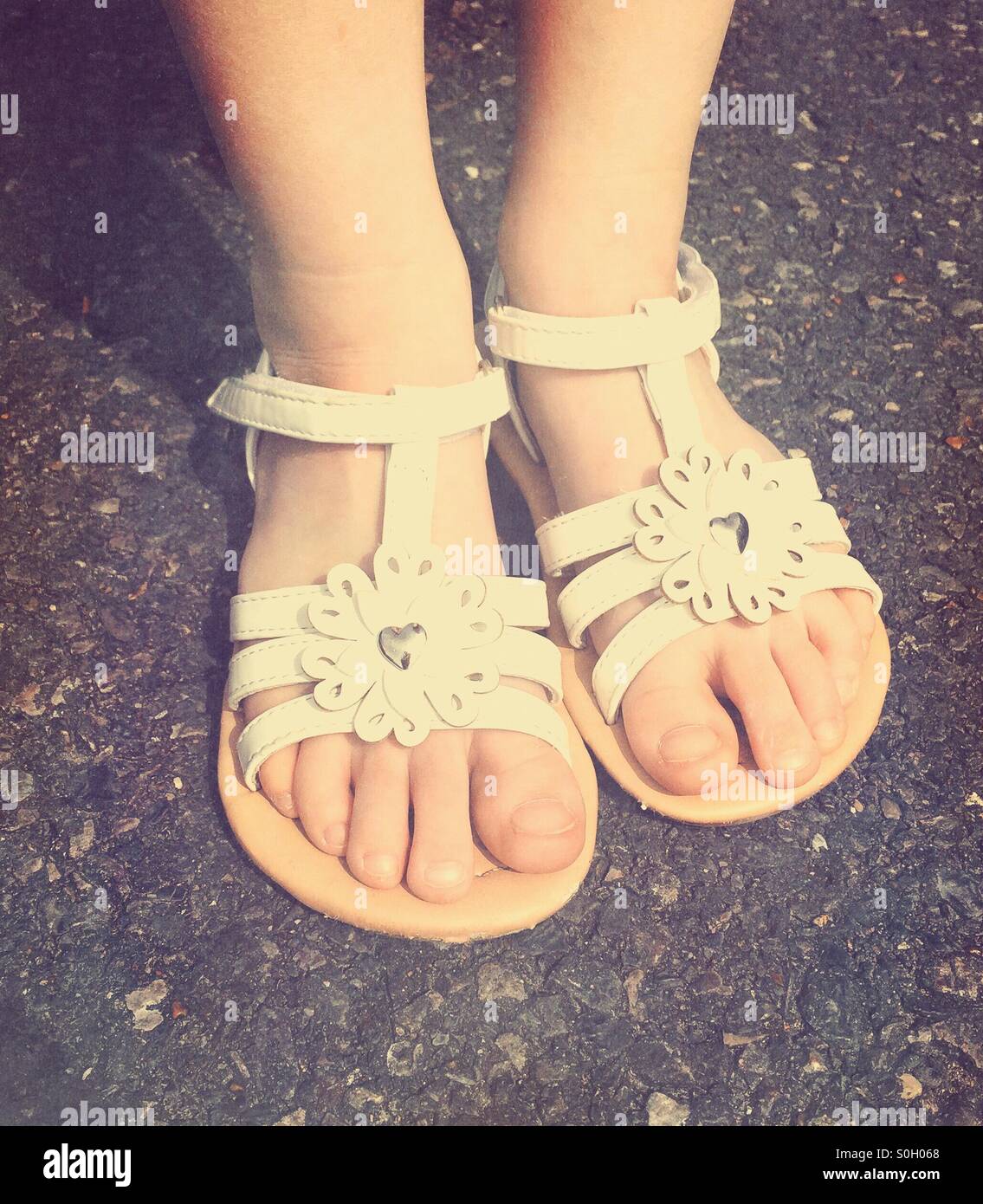 Girls feet in sandals hi-res stock photography and images - Alamy