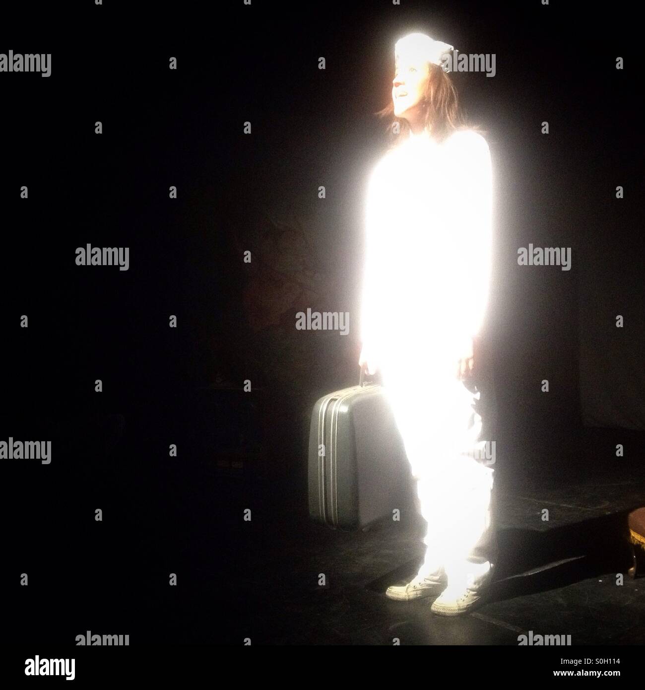 An actor holds a bag performs Vida y Obra de Dalomismo in Foro Contigo America theater in Colonia Napoles, Mexico City, Mexico - Smartphone Captured Stock Image An actor holds a bag performs Vida y Obra de Dalomismo in Foro Contigo America theater in Colonia Napoles, Mexico City, Mexico - Smartphone Captured Stock Image