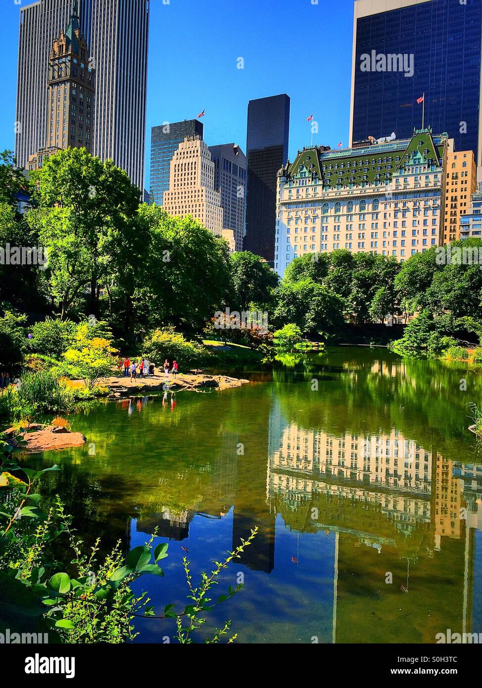 The plaza hotel overlooking the pond in Central Park NYC - Smartphone Captured Stock Image