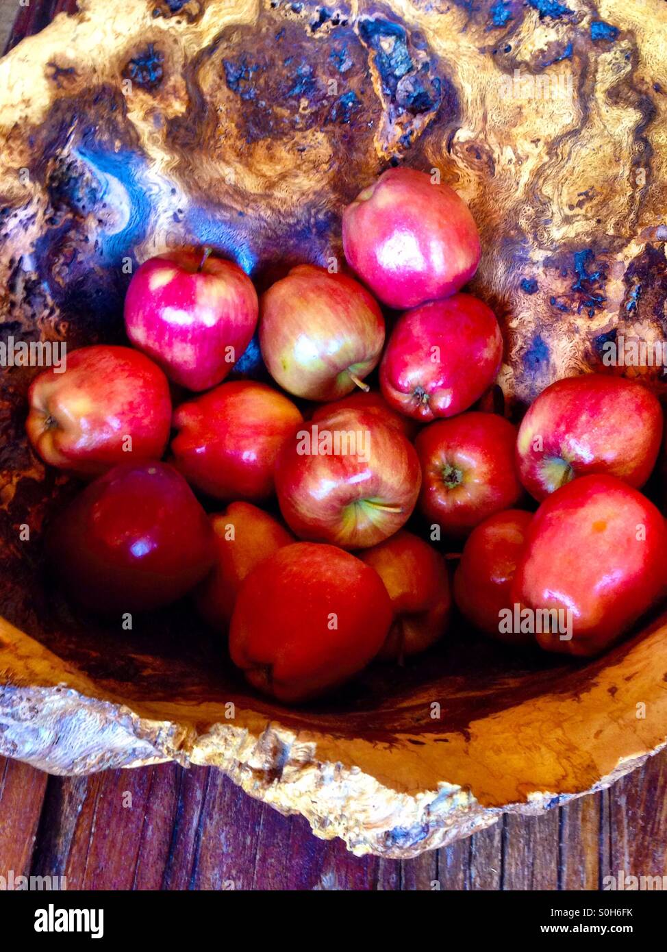 Wooden bowl with red apples Stock Photo