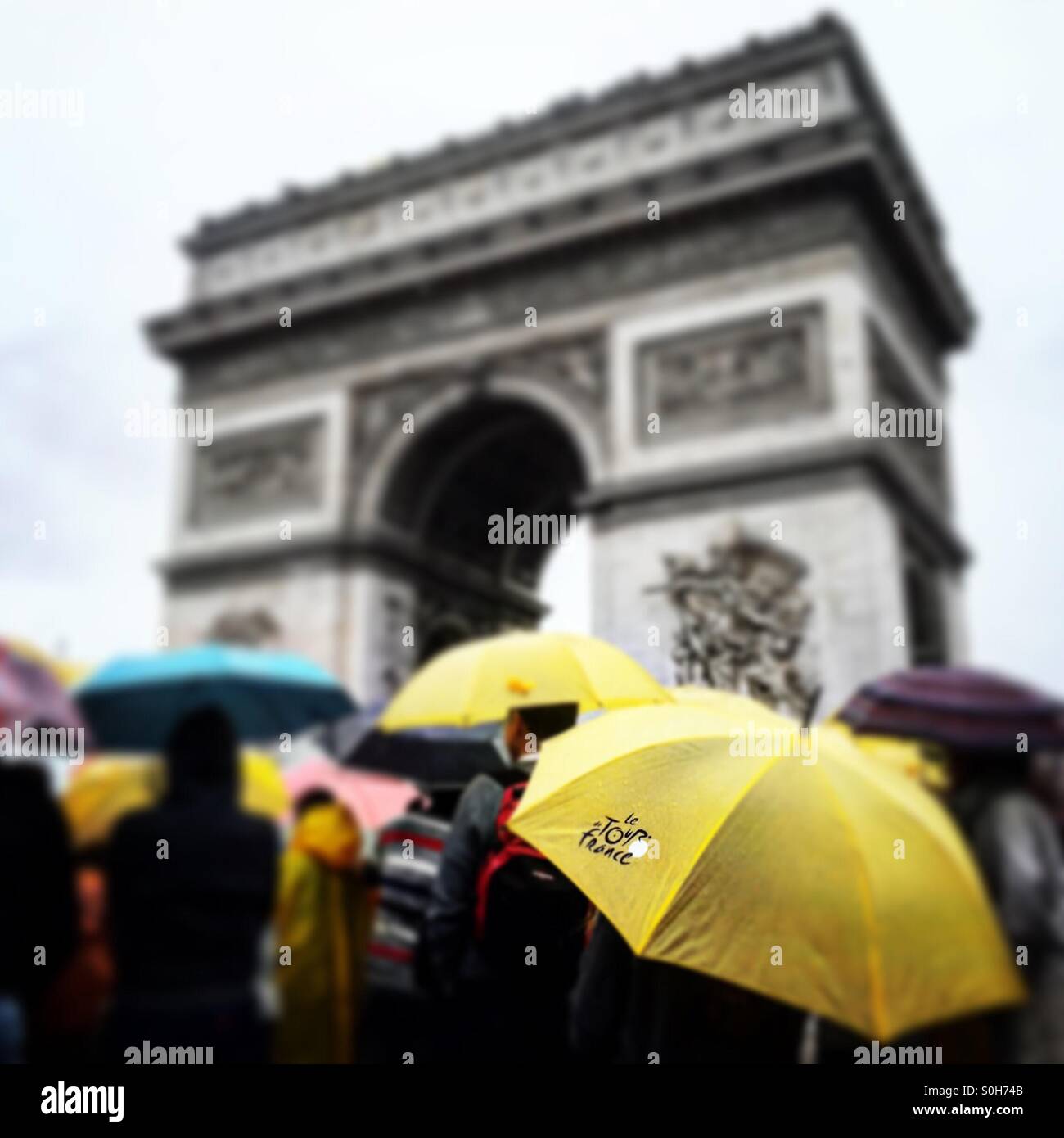 A sea of umbrellas for the final stage of the 2015 Tour de France, next to the Arc de Triomphe, Paris. Stock Photo