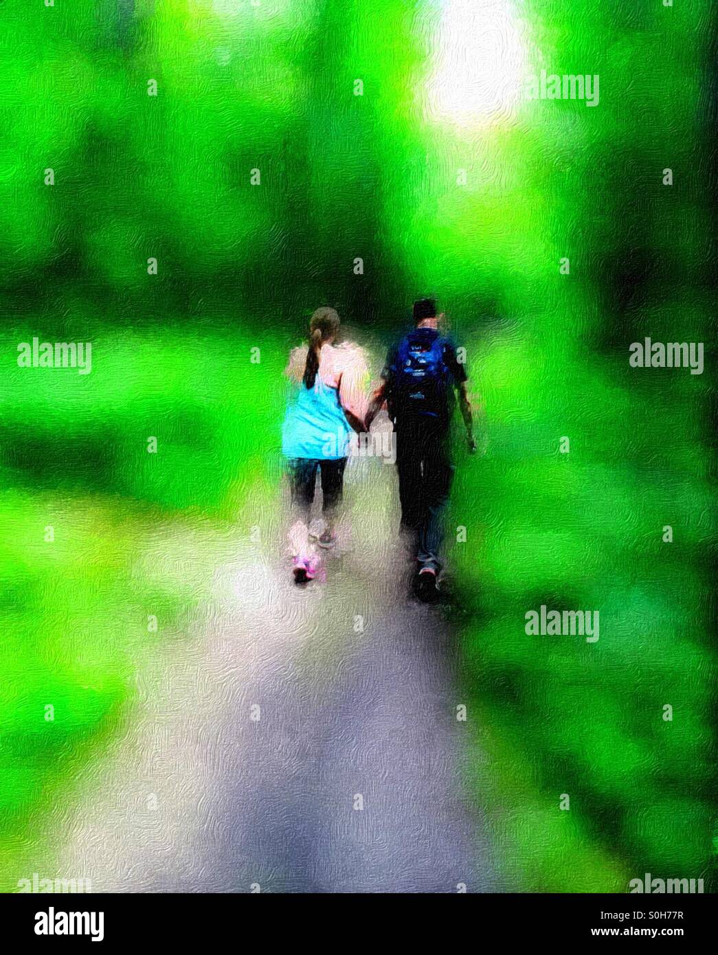 Painted  woods. A man and a woman holding hands walking in a whimsical woodland setting. Sylvan surroundings. - Smartphone Captured Stock Image