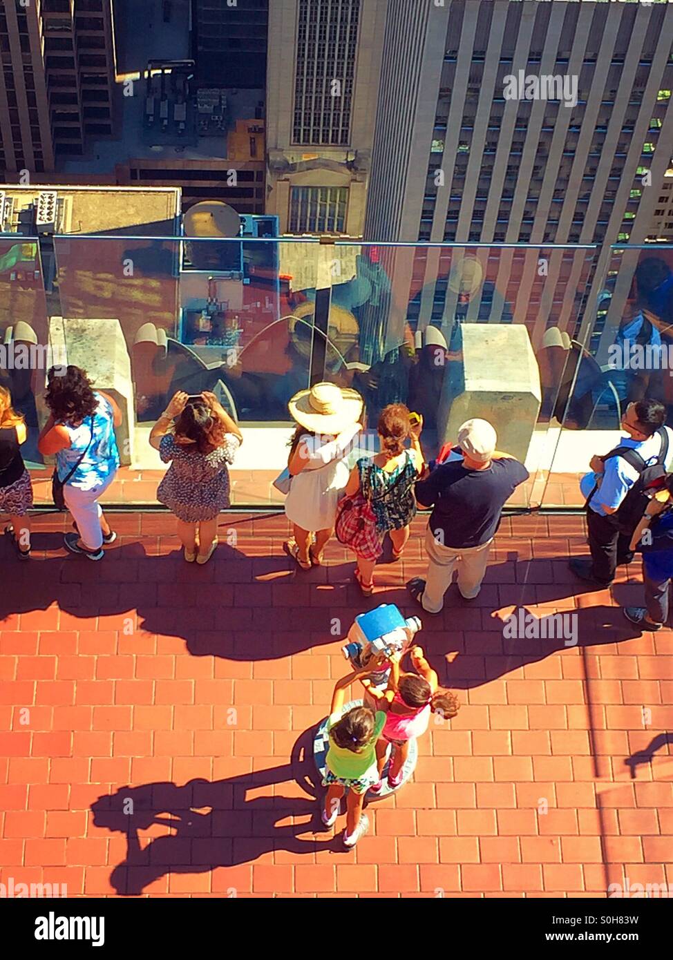 Tourists at Rockefeller Center's top of the rock in New York City, USA - Smartphone Captured Stock Image