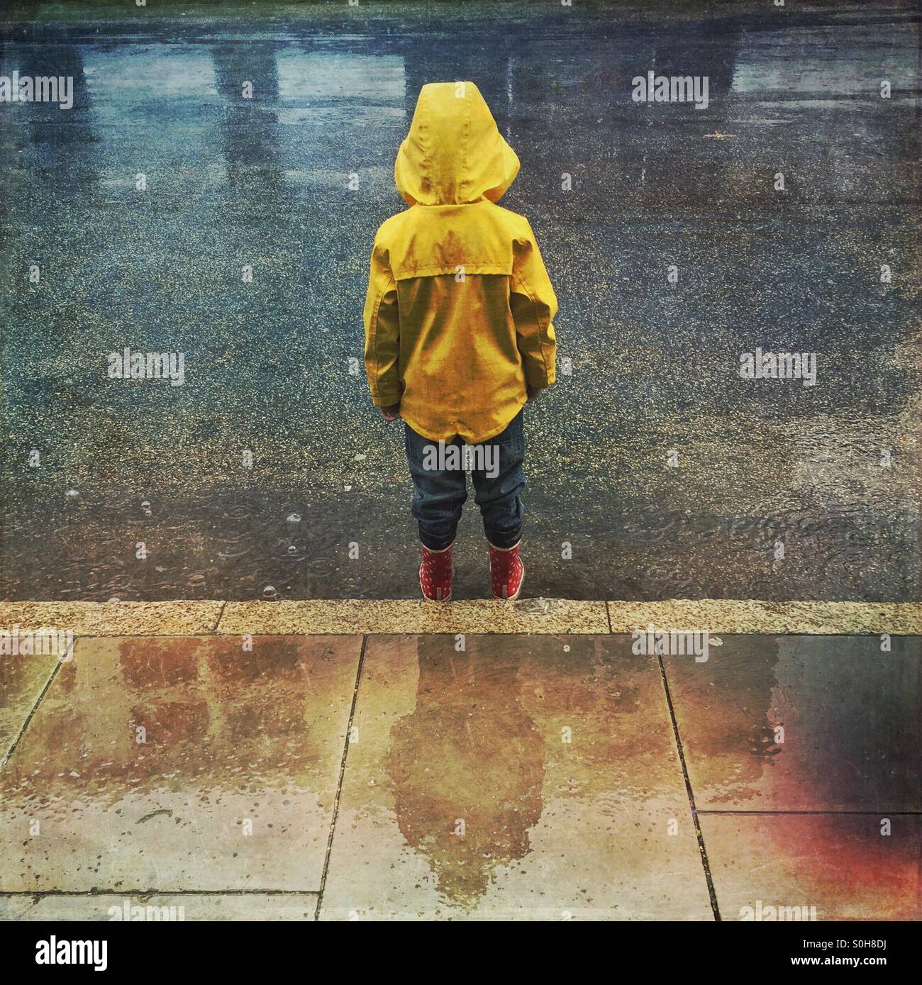 Child in the rain Stock Photo Alamy