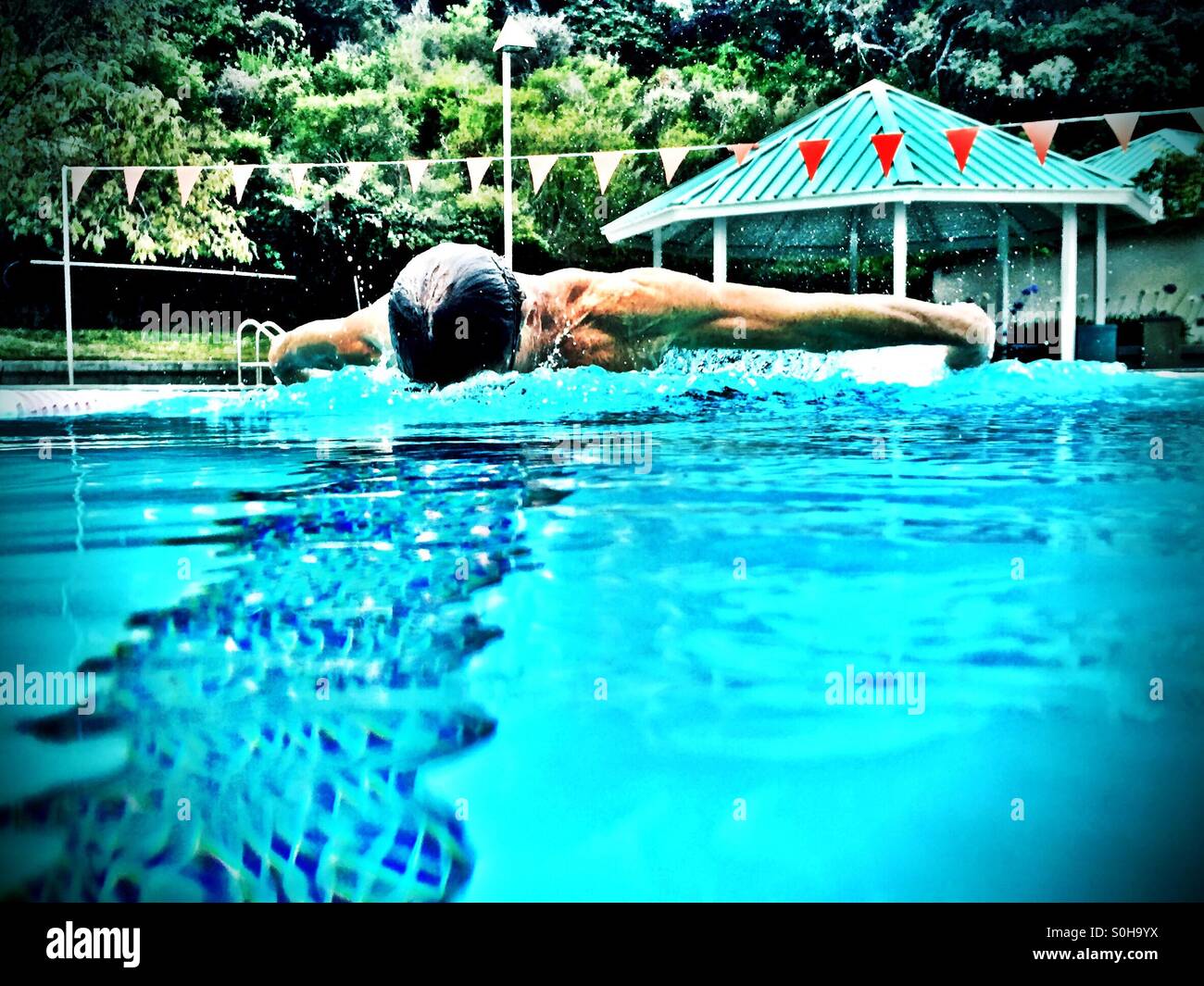 One man swimming butterfly. - Smartphone Captured Stock Image
