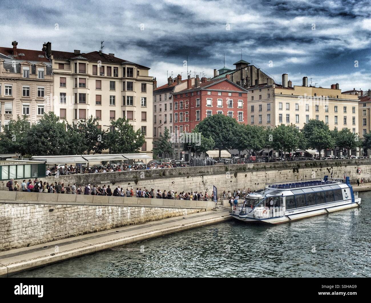 People waiting for a city cruise, Saône, Lyon, France - Smartphone Captured Stock Image