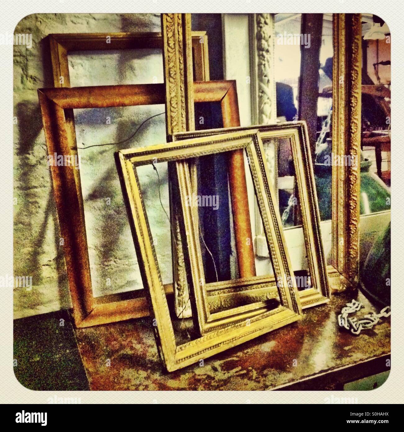 Discarded frames of various sizes in an art gallery Stock Photo