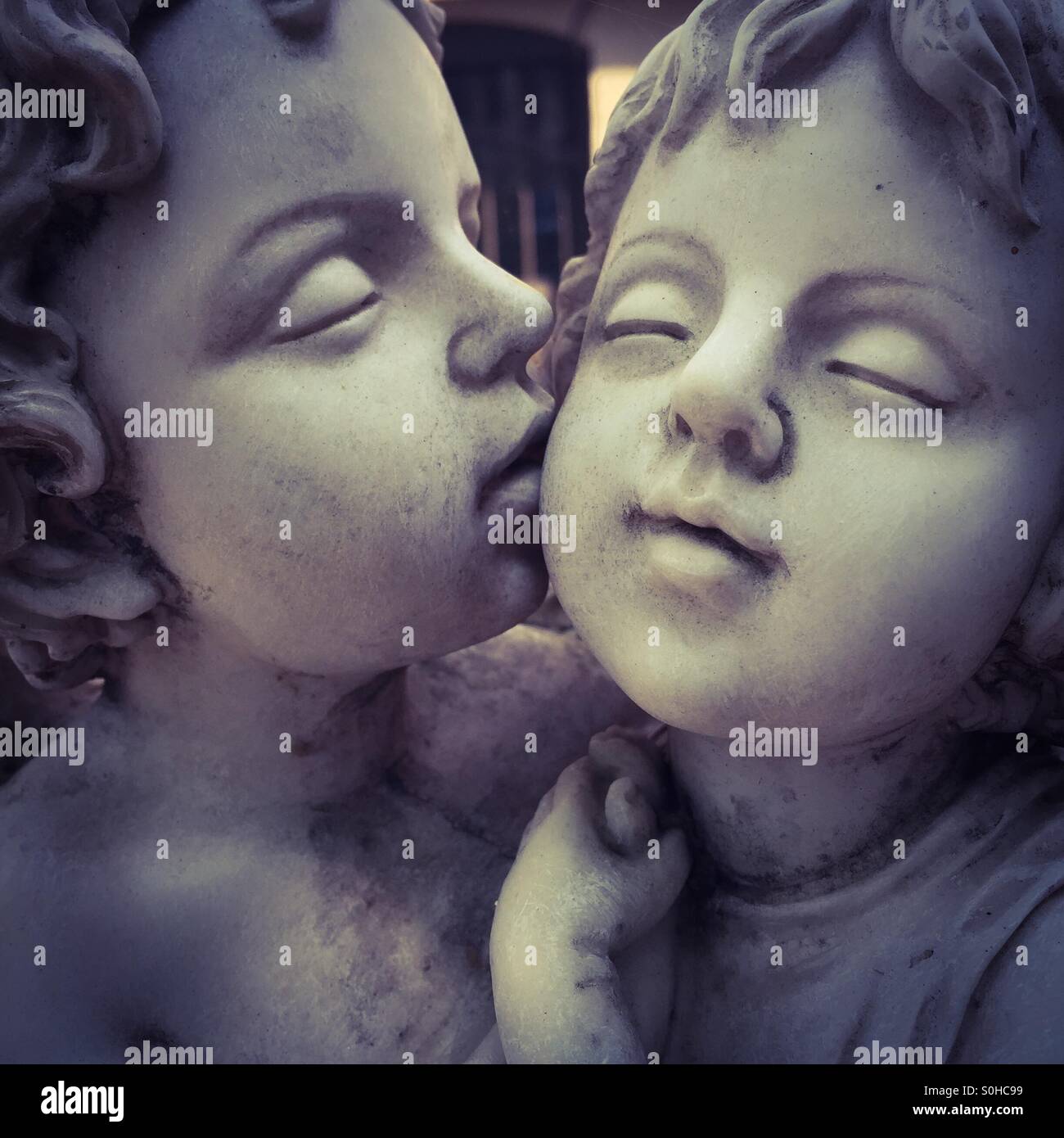 Statues kissing Stock Photo