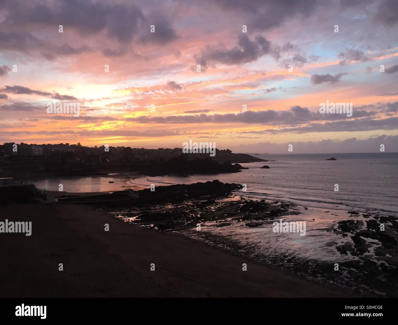 Sunset on the beach Stock Photo - Alamy