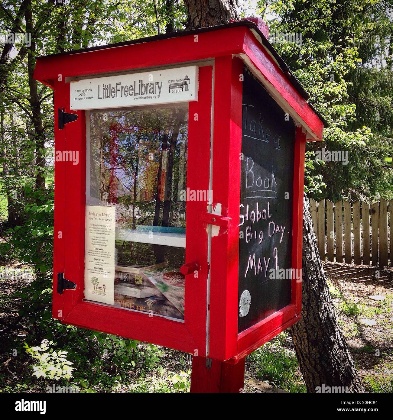 Little Free Library established on a walking path in Normal Illinois Stock Photo