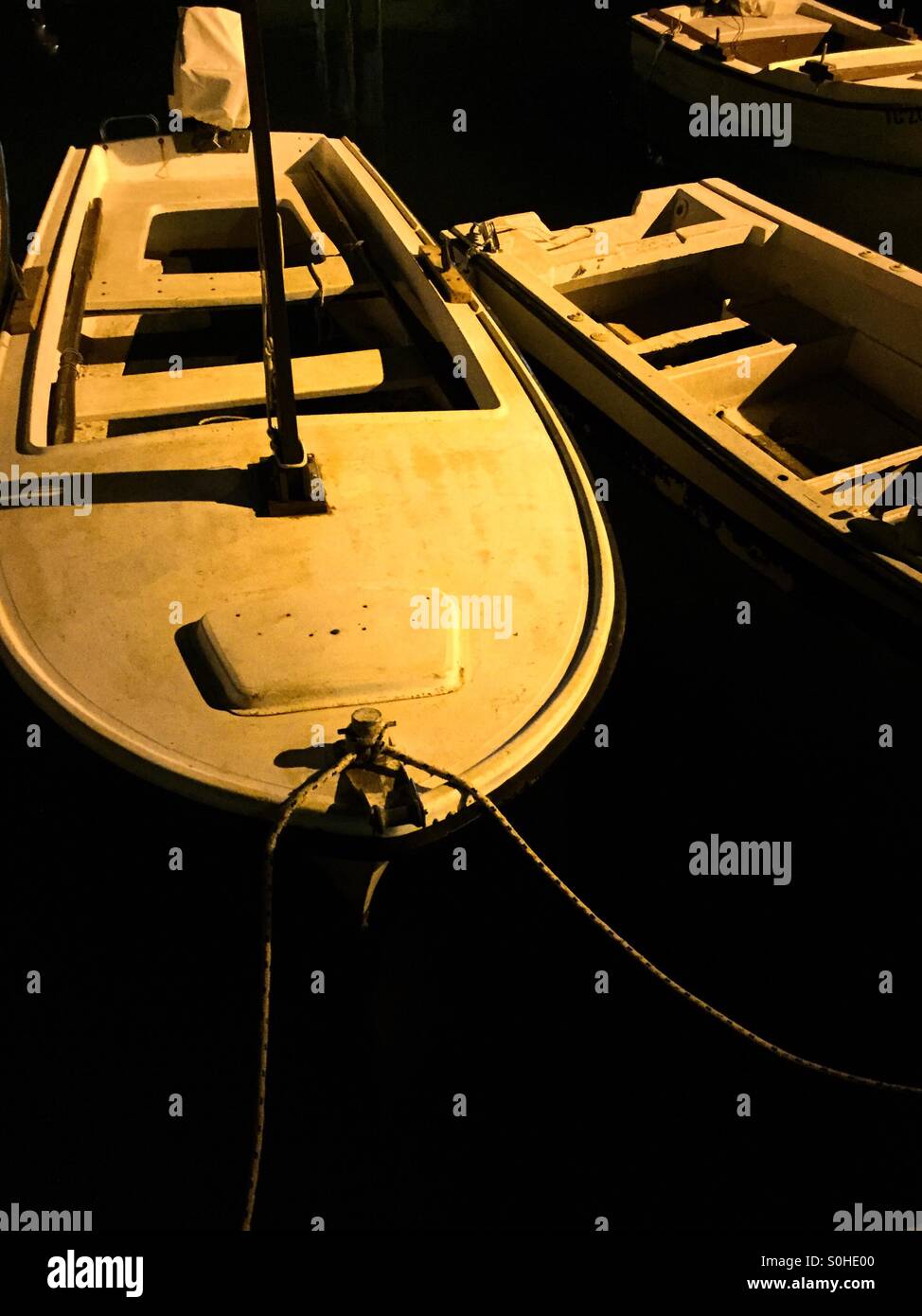 Boats in harbour illuminated by the moon - Smartphone Captured Stock Image