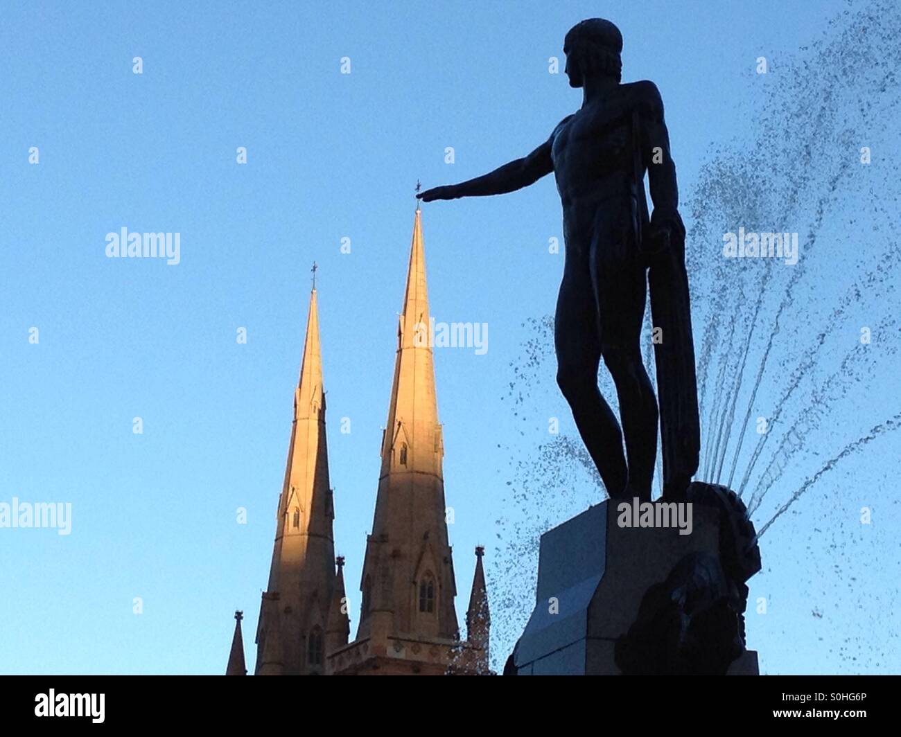 The Archibald Fountain meets the spires of St Mary's Cathedral in Sydney, Australia - Smartphone Captured Stock Image