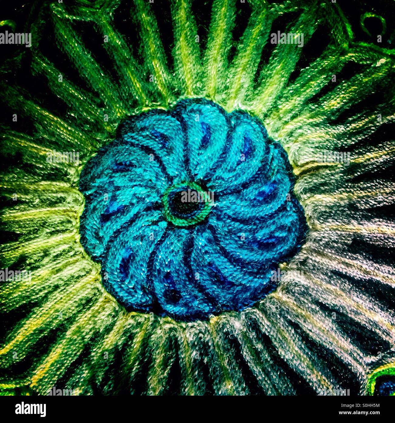 A blue flower made by Wirarika Indians decorates a restaurant in Colonia Roma, Mexico City , Mexico - Smartphone Captured Stock Image