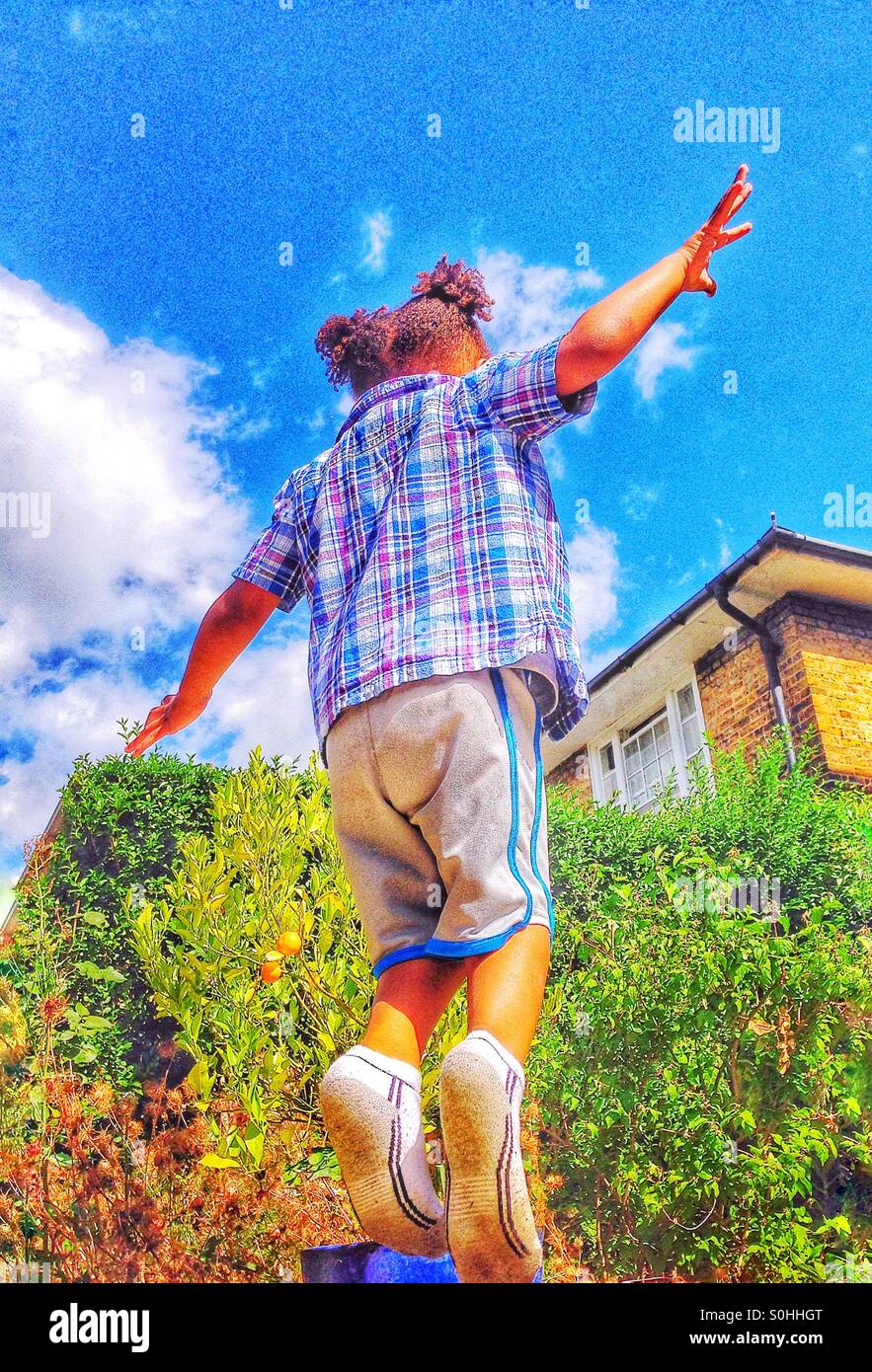 Child at play on a trampoline - Smartphone Captured Stock Image