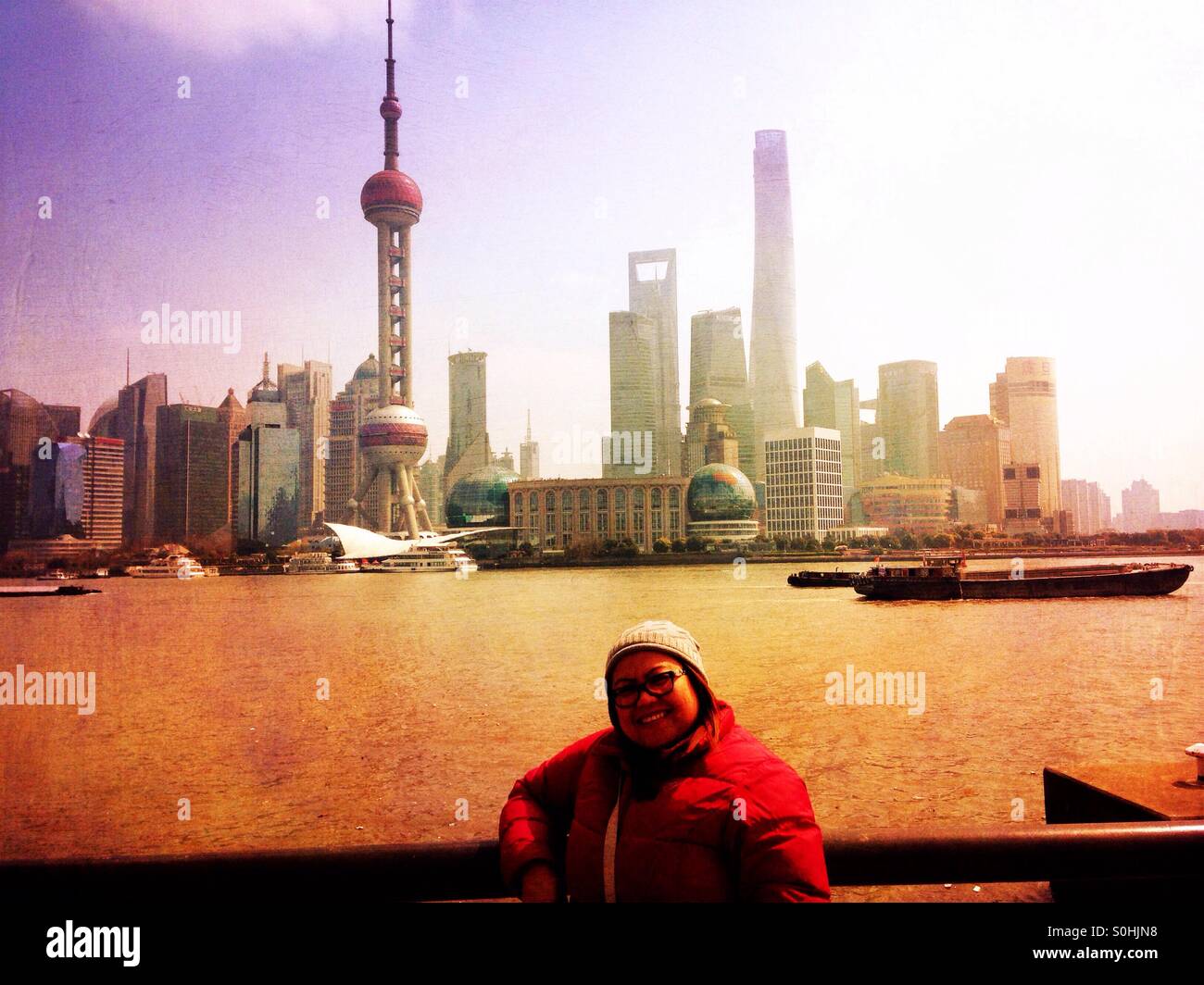 A tourist at The River Bund in Shanghai, China. - Smartphone Captured Stock Image