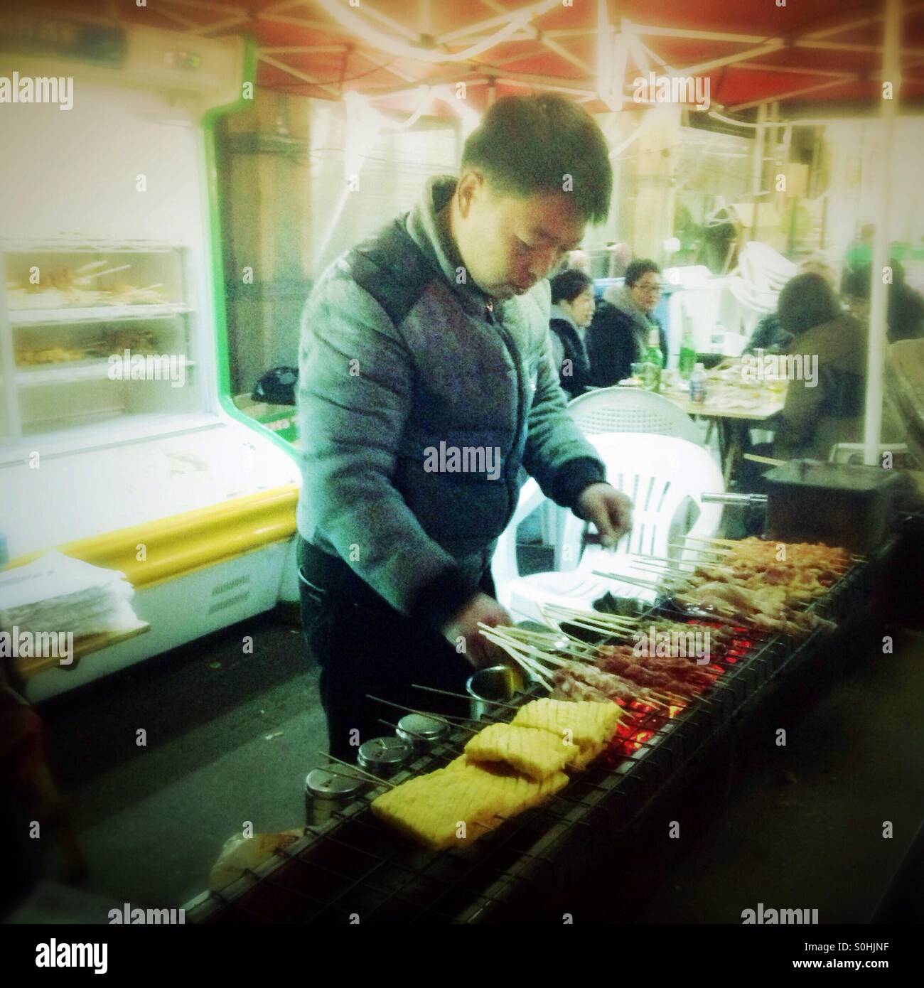 Man cooking street food in Shanghai. Stock Photo