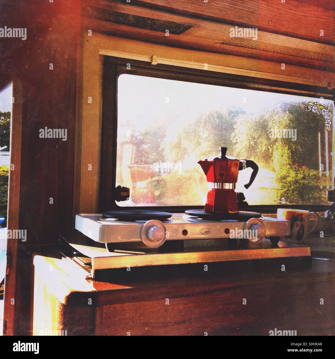 Coffee pot on electric hob in camper van Stock Photo Alamy