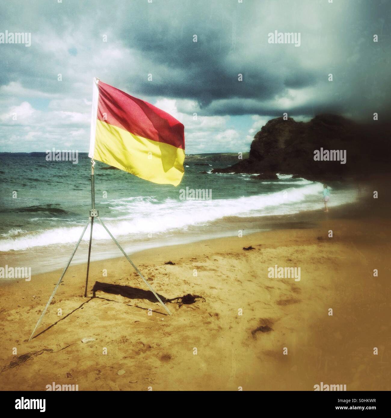 Lifeguards swimming flags, Hope Cove beach, Devon, England, United Kingdom. - Smartphone Captured Stock Image