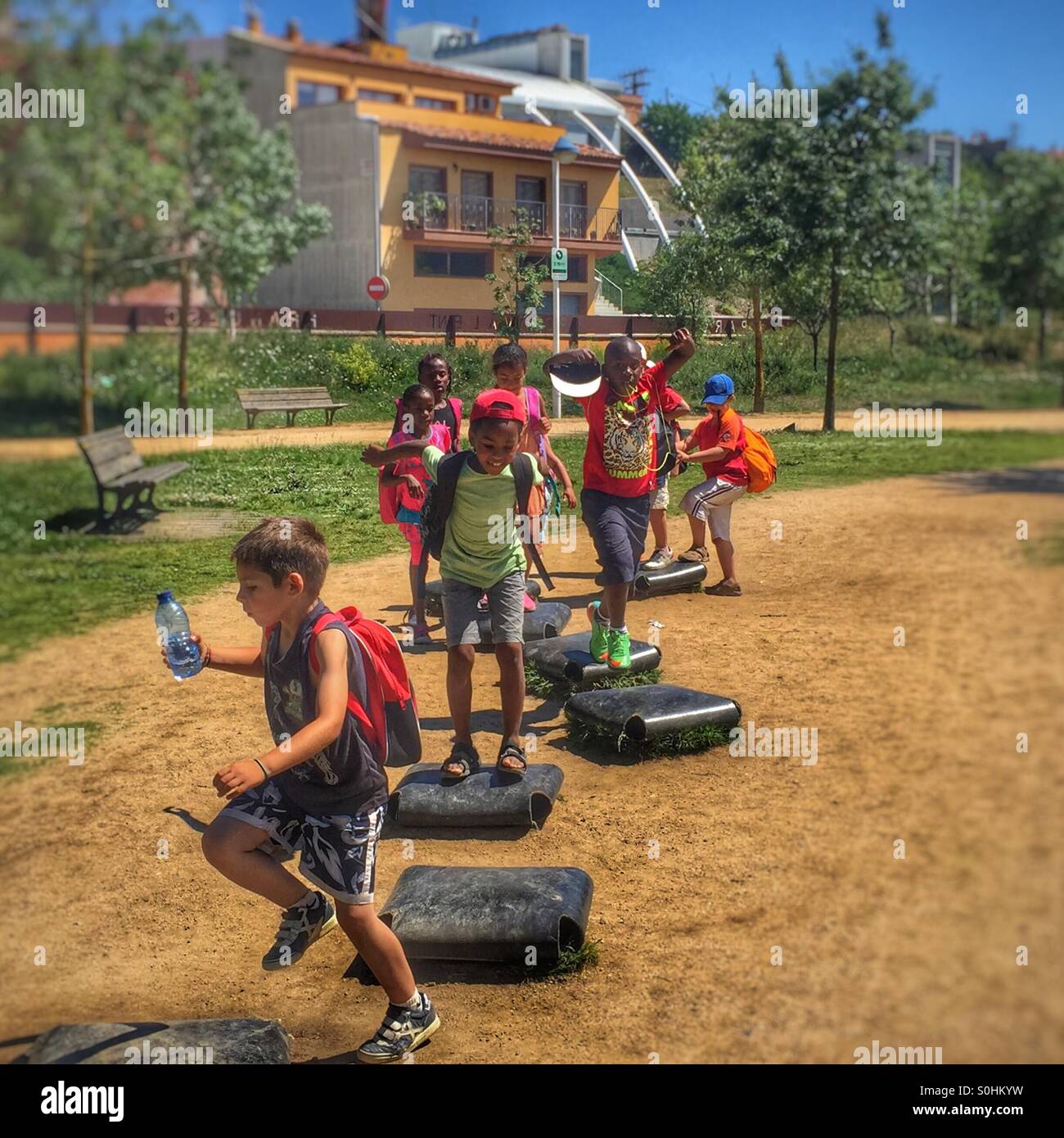 Childrens playing on a playground, Mallgrat de Mar, Spain - Smartphone Captured Stock Image