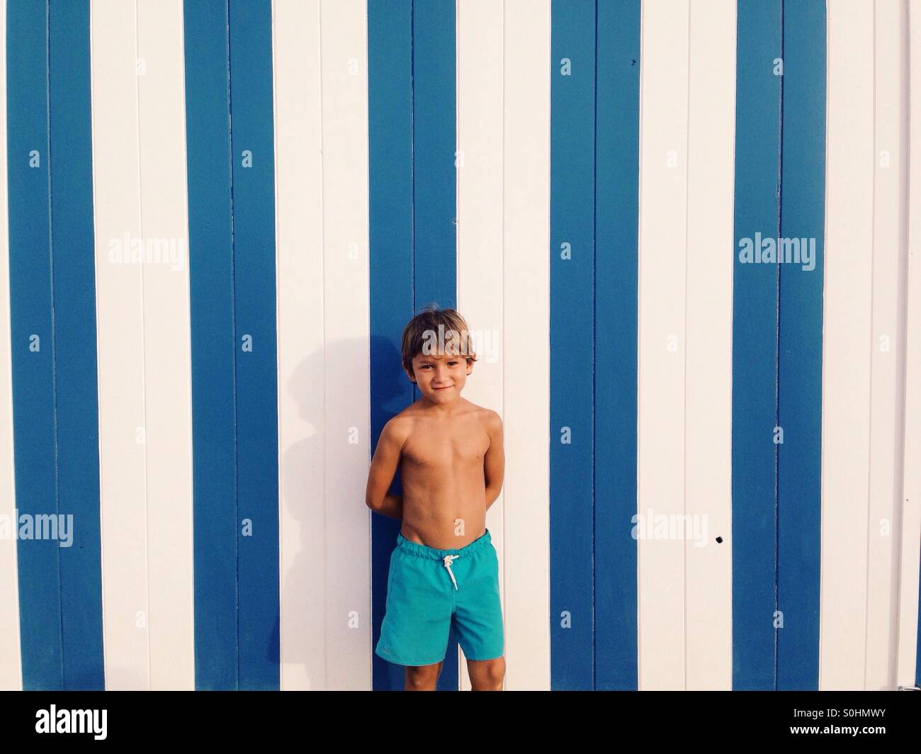Six years old boy portrait with blue swimwear Stock Photo