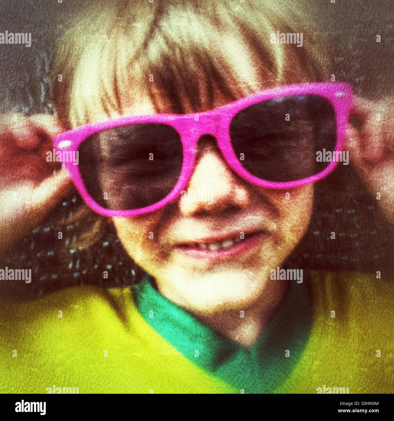 Four year old boy in oversized sunglasses - Smartphone Captured Stock Image