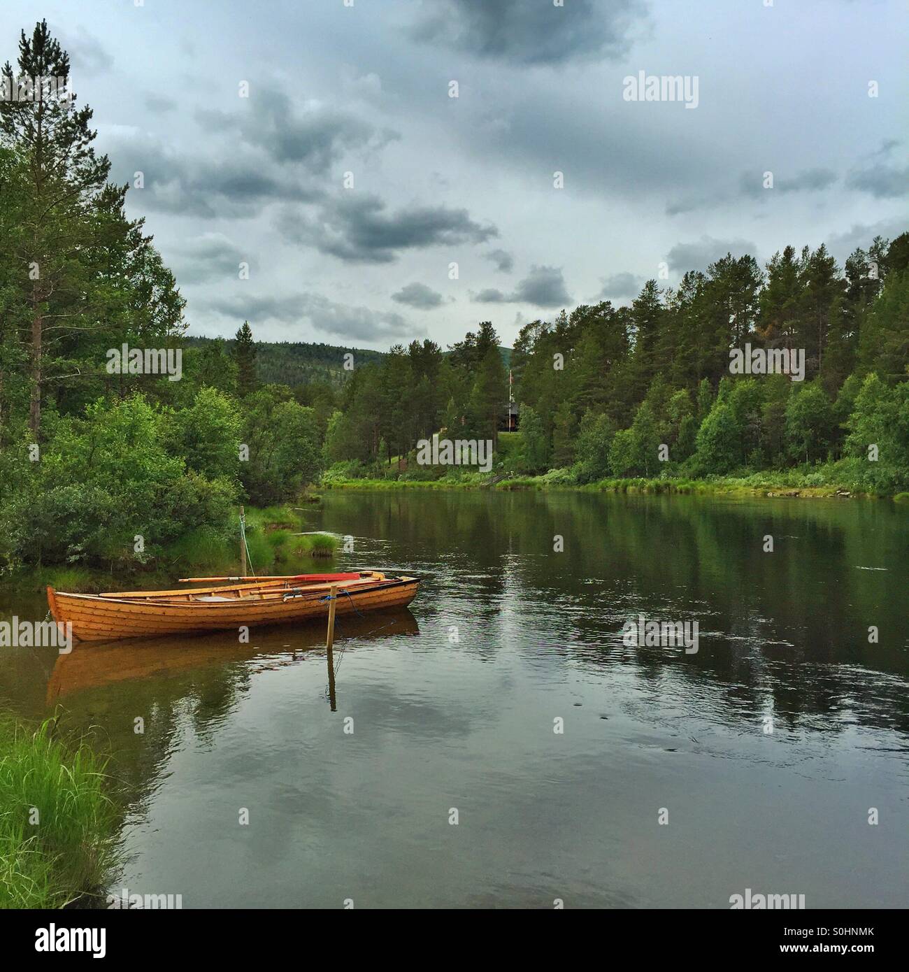 Boat on river in Norway Stock Photo