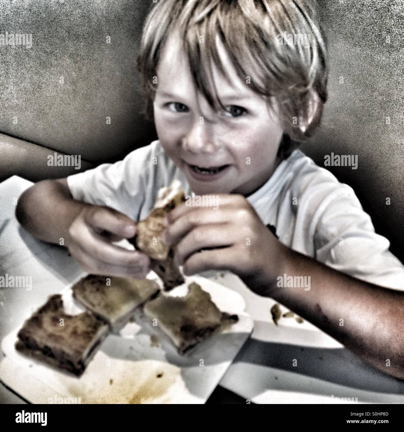 Five year old eating sandwich - Smartphone Captured Stock Image