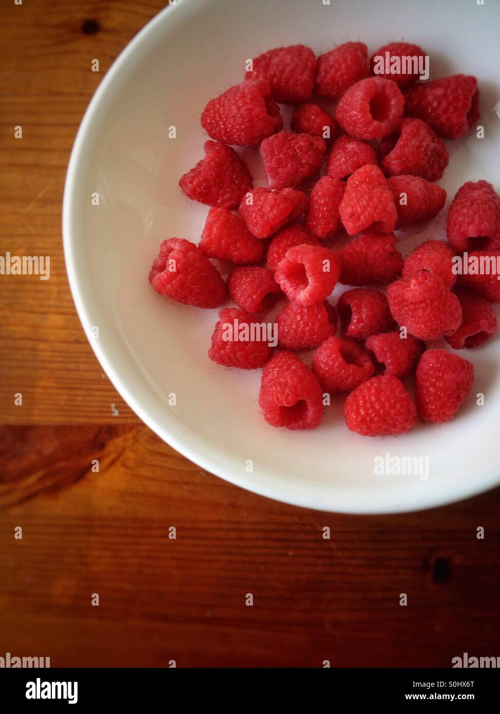 Aerial view of raspberry in a bowl Stock Photo