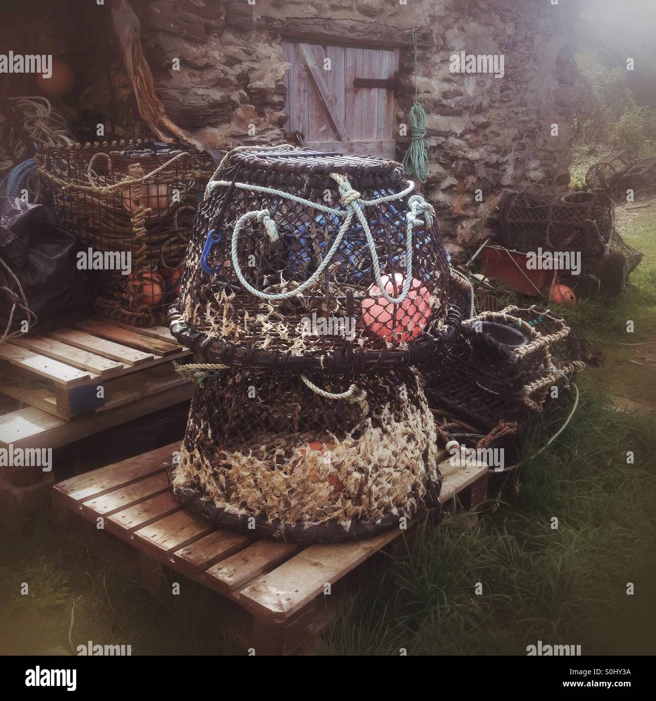 Old lobster pots, Hope cove, Devon, England, United Kingdom. - Smartphone Captured Stock Image